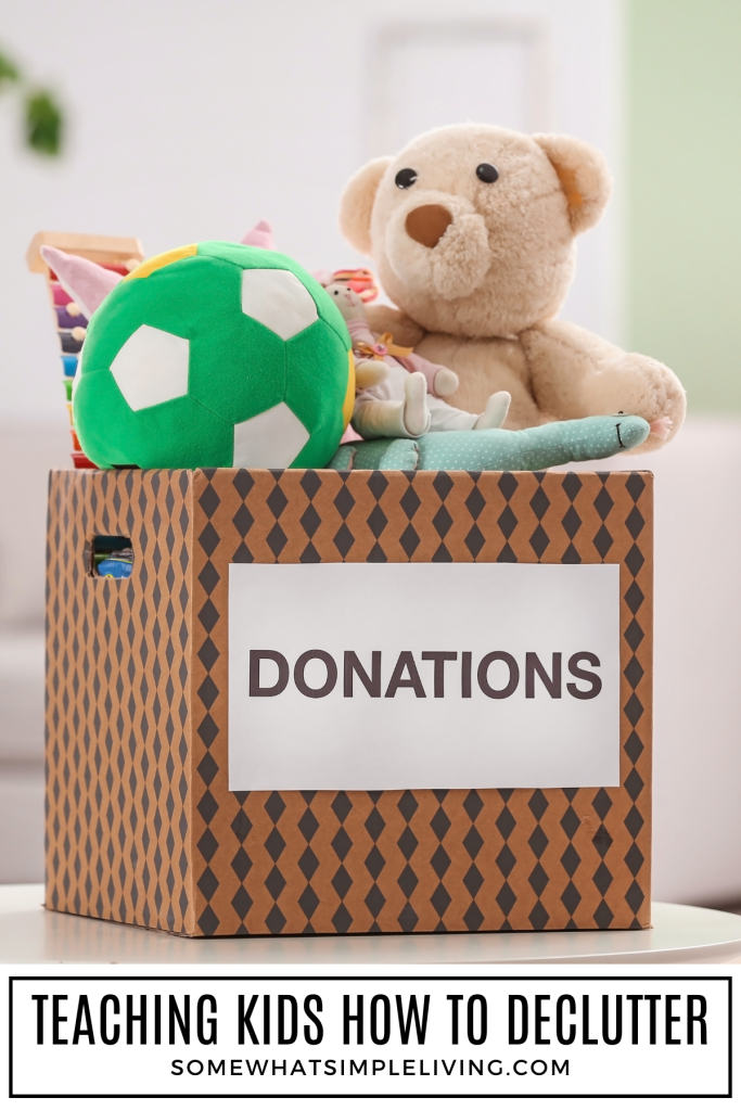 toys in a donation box with a text overlay "teaching kids how to declutter"