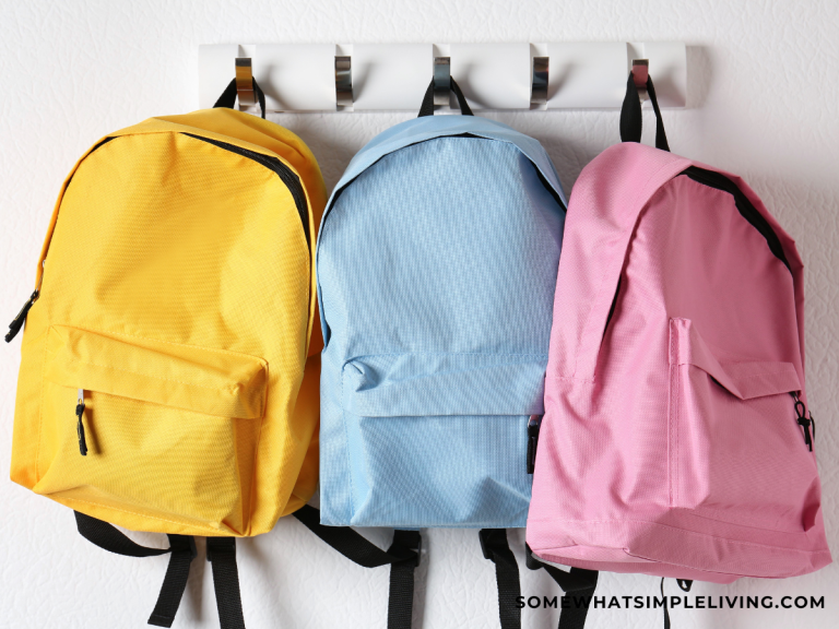 colorful backpacks hanging on a wall