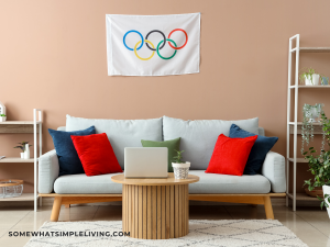 Couch with an olympic flag hanging on it