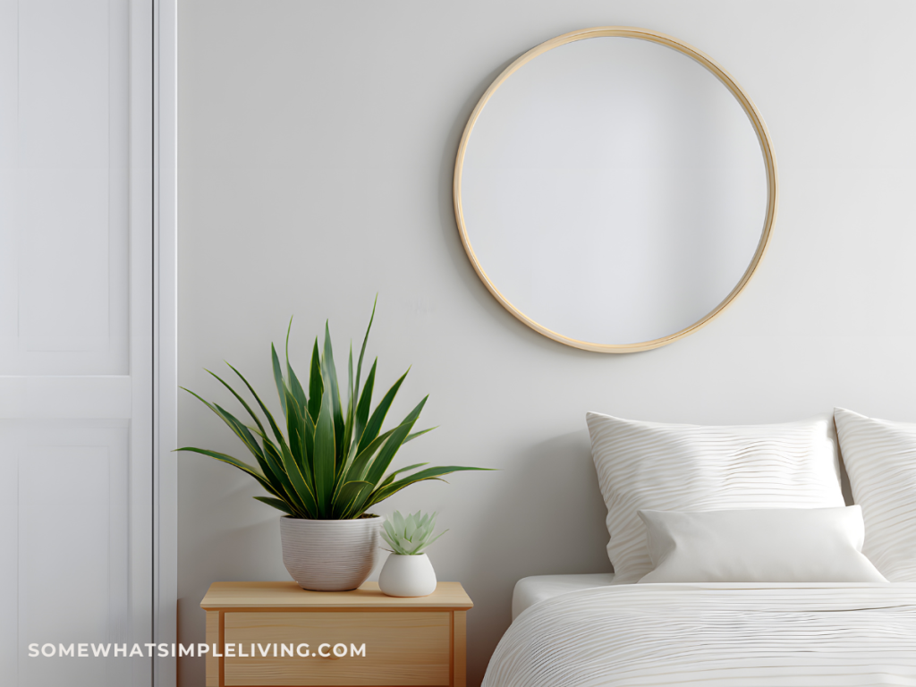 simplified nightstand next to bed with white bedding