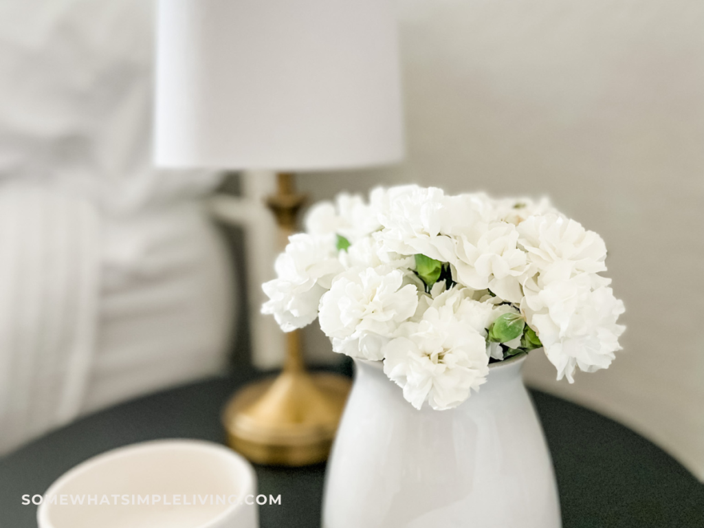 close up of flowers on a nightstand