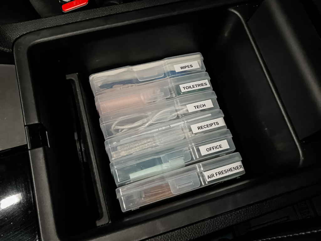 using plastic photo boxes to organize a car console
