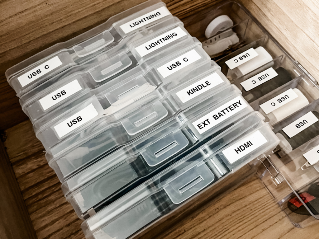 using plastic photo boxes to organize cords