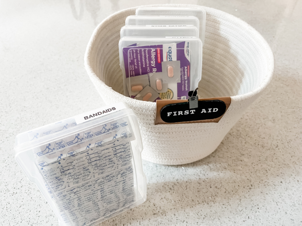 using plastic photo boxes to organize first aid supplies