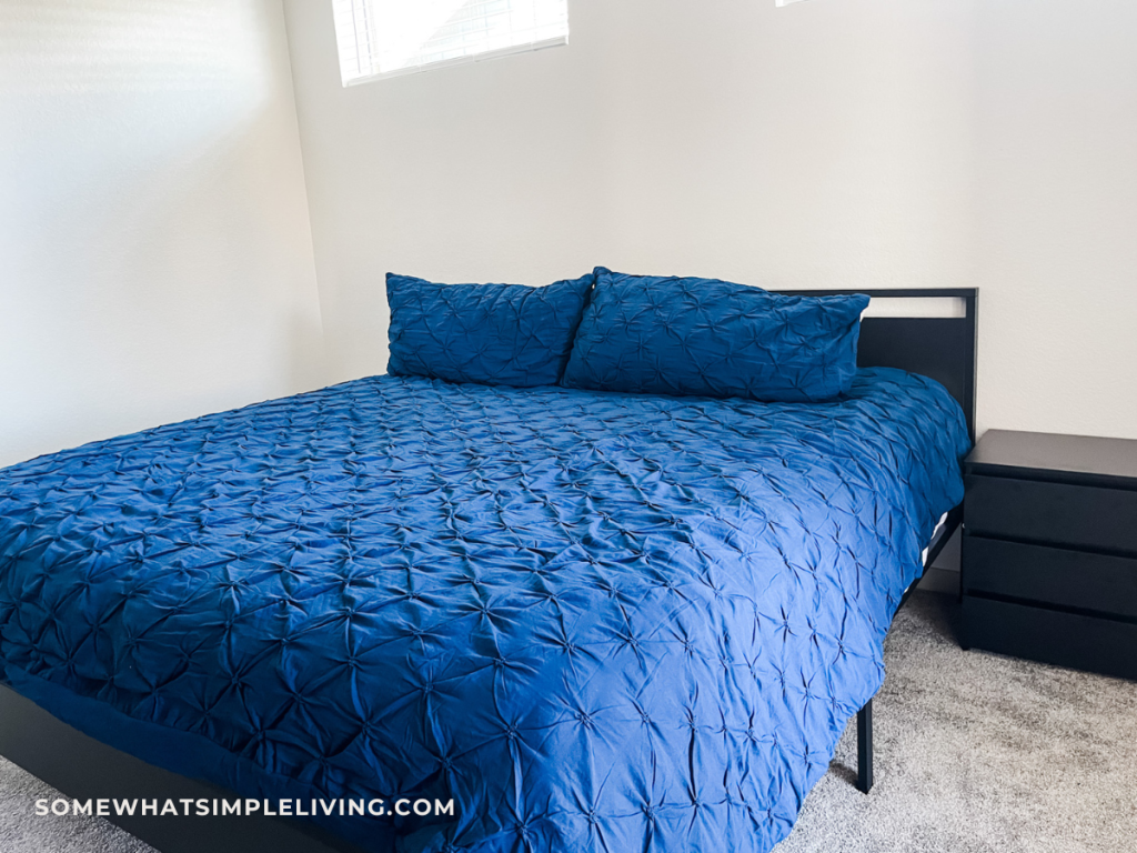 simplified bed with blue comforter