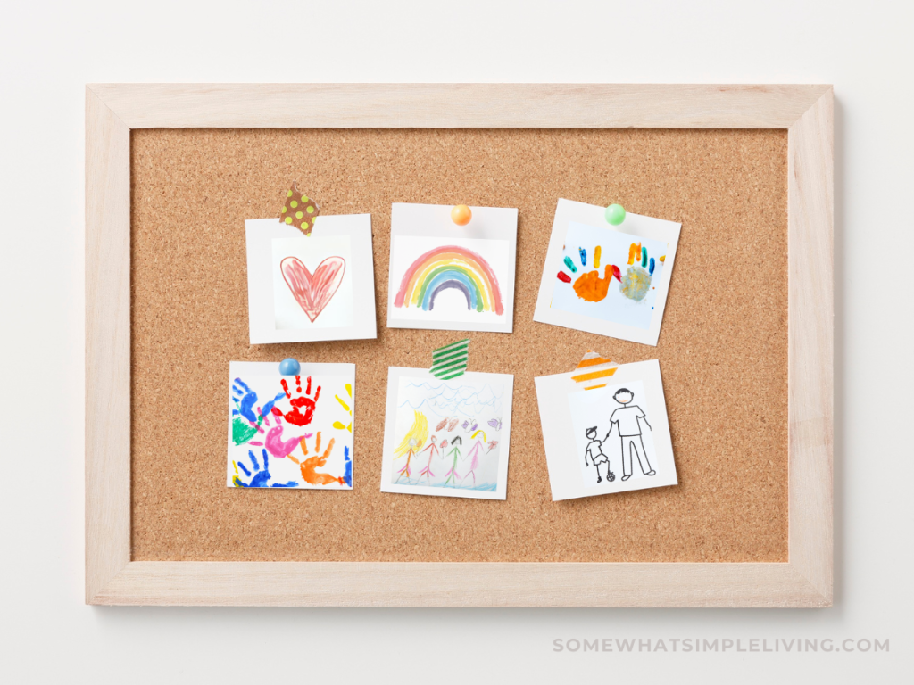 bulletin board with childs drawings on it