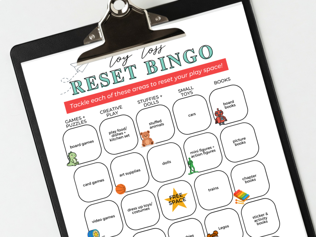 printable toy toss bingo card on a black clipboard
