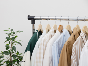 capsule wardrobe hanging next to a potted plant