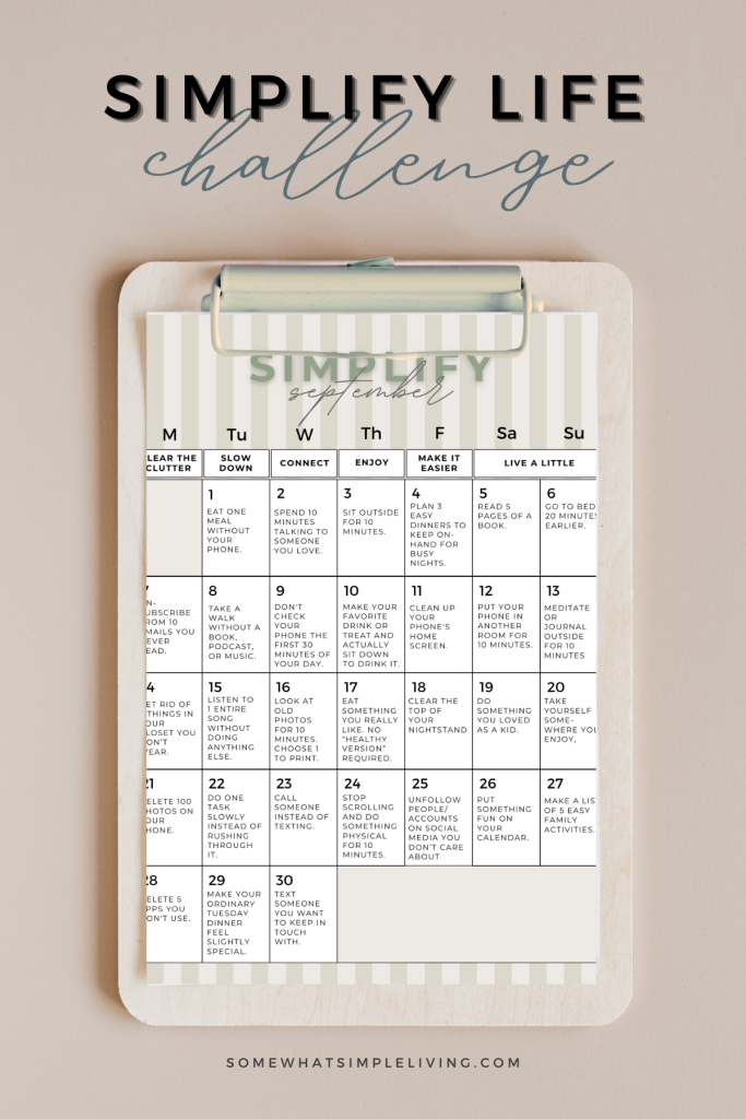 clipboard with a Simplify Life Challenge Calendar printed